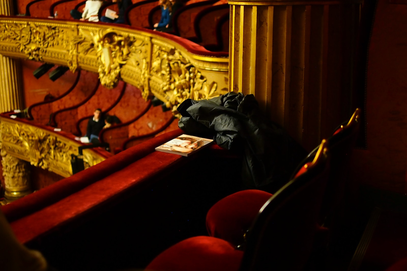 black leather jacket on red chair