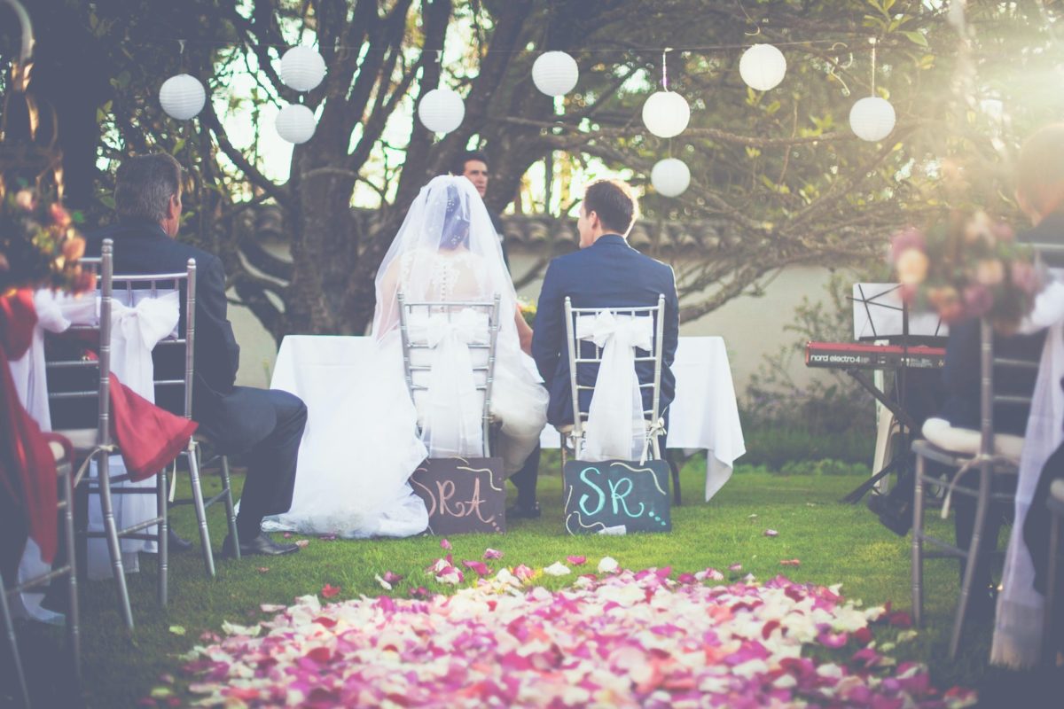 bride and groom having wedding ceremony