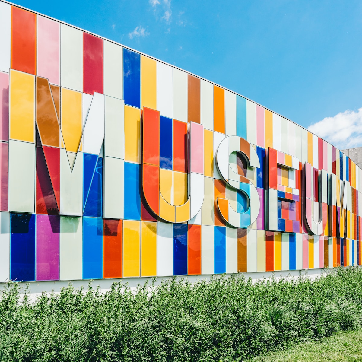 photo of Museum signage near green leafed plants