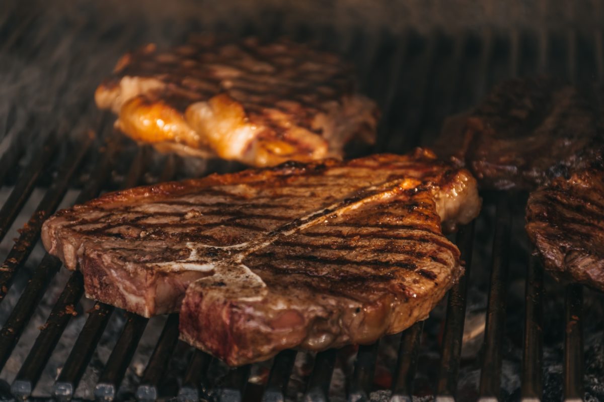 grilled meat on black charcoal grill