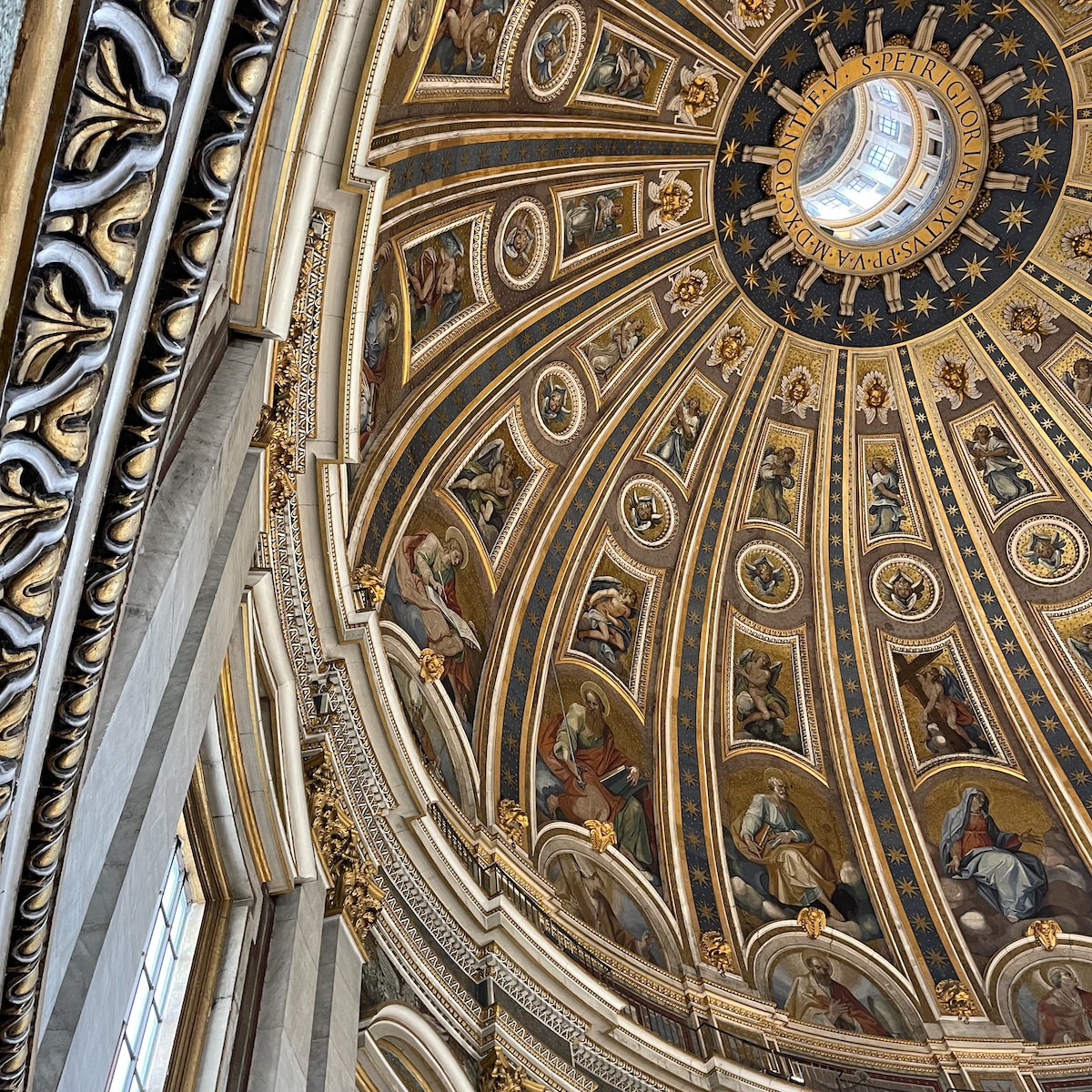 a large ornate ceiling with statues