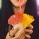 woman drinking shake using straw